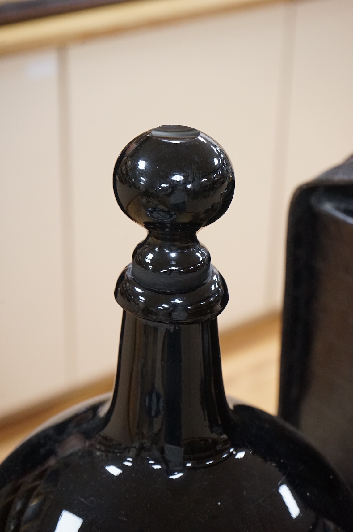 A late 19th / early 20th century dark amethyst pharmacy jar with stopper, 39cm high